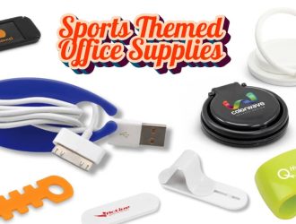 Branded sports-themed office supplies on a desk, including pens, notebooks, and a football-shaped stress ball